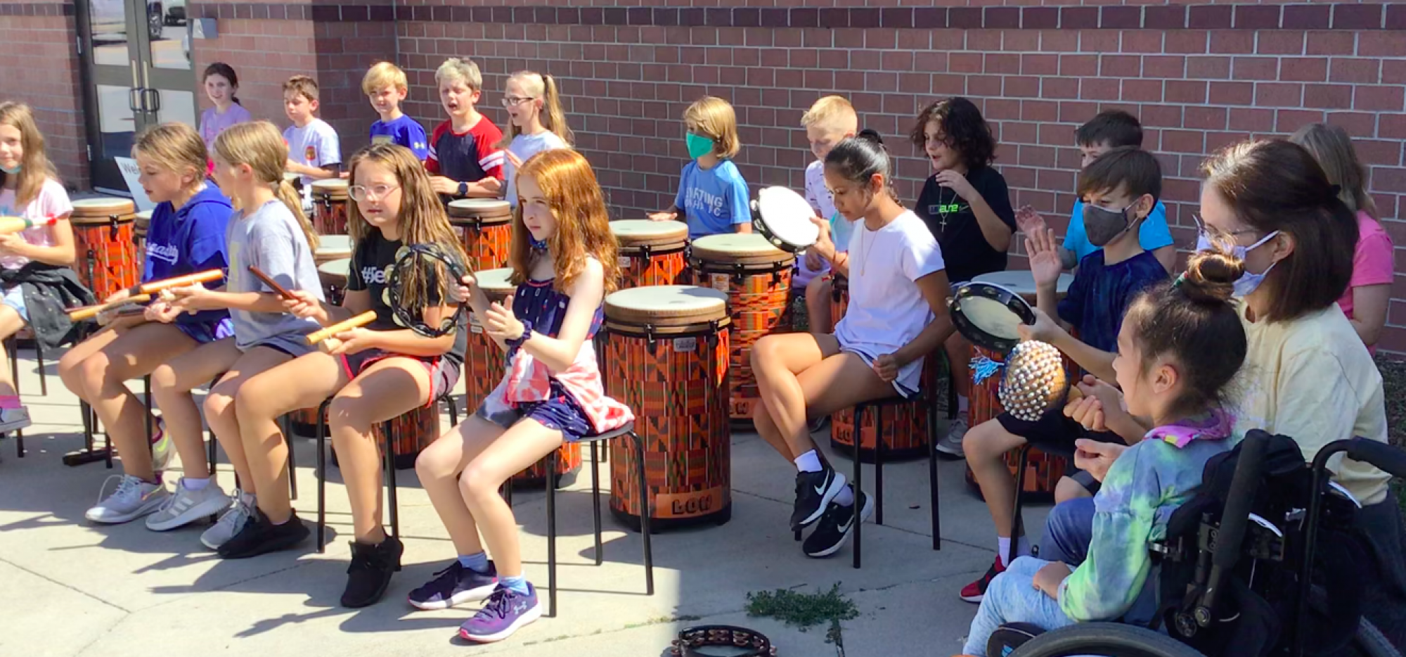 Students playing instruments in music